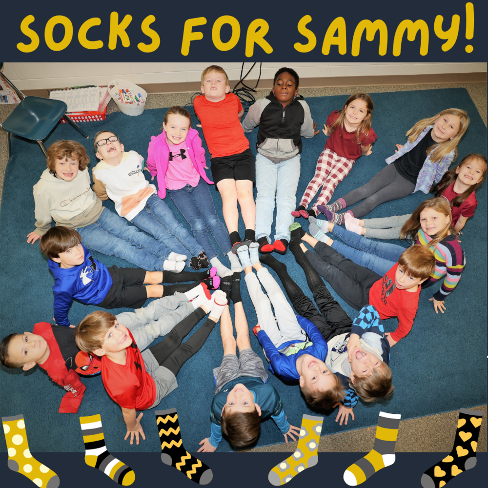 Mrs. Graham's 1st grade class showing off their sockfeet in support of Samuel Mitchell, son of EIP teacher, Paula Mitchell